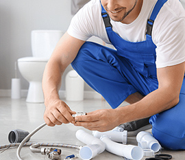 Plumber working in a bathroom